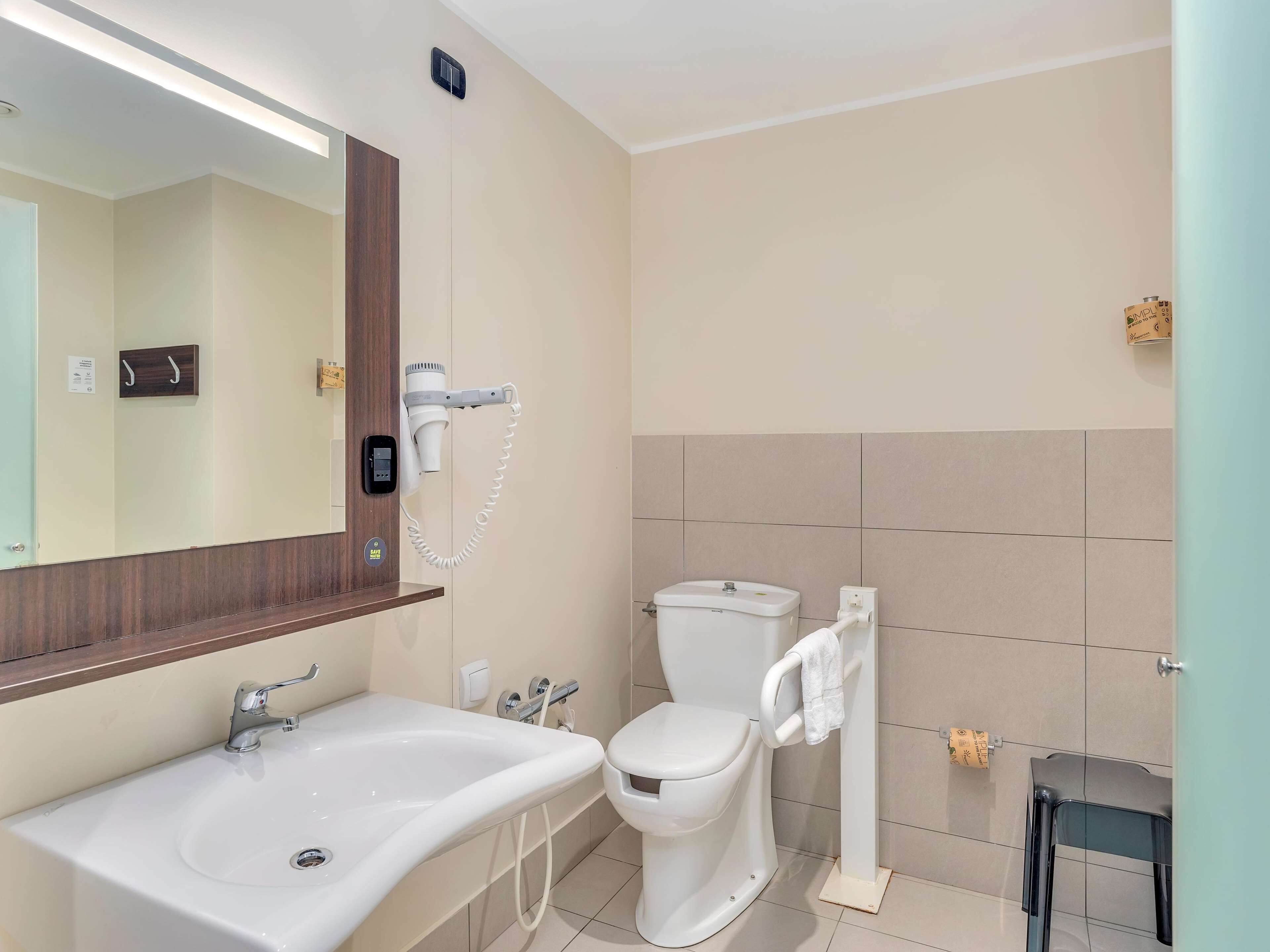 shower, hair dryer, bidet, towels