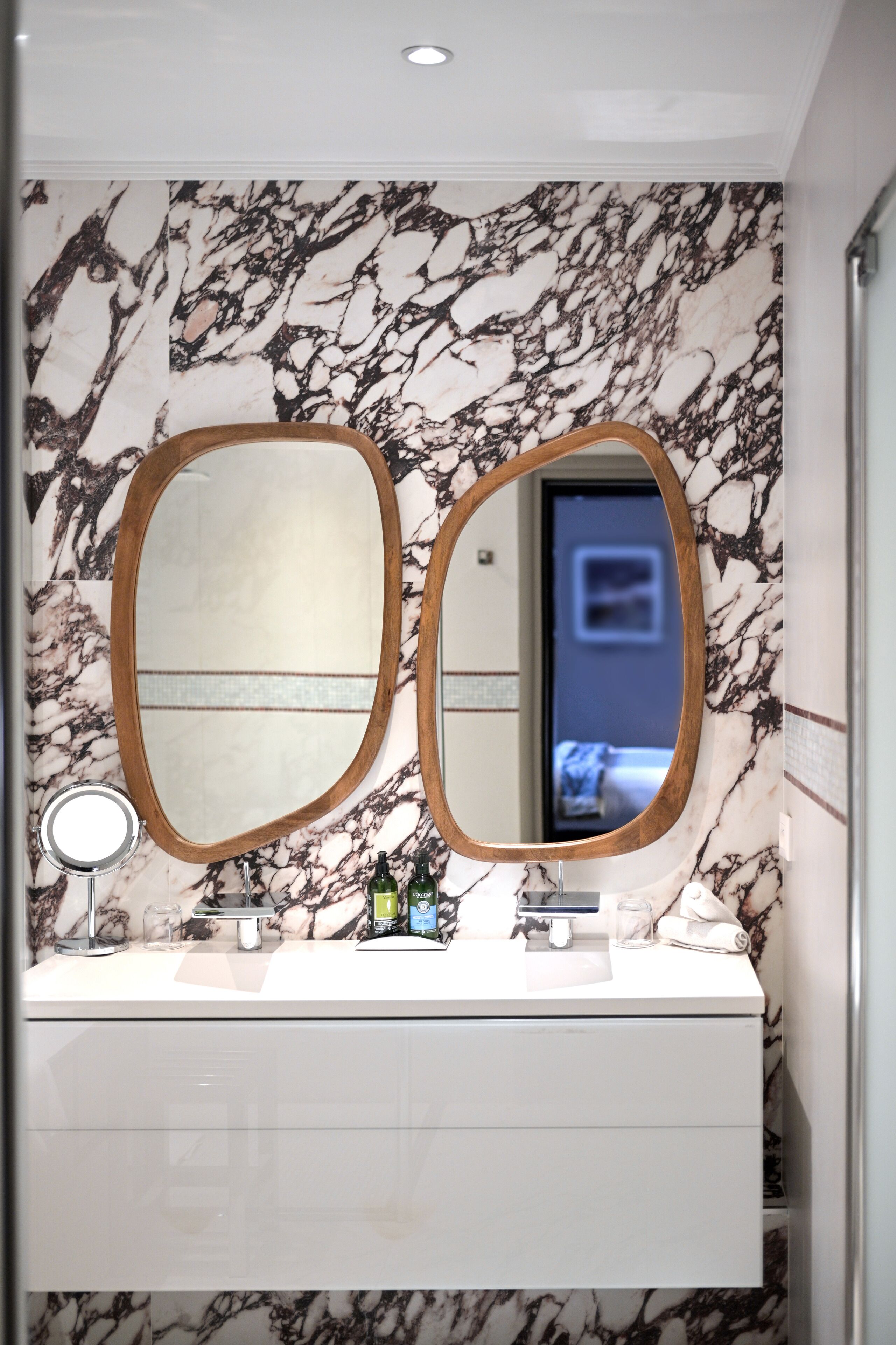 designer toiletries, hair dryer, bathrobes, slippers