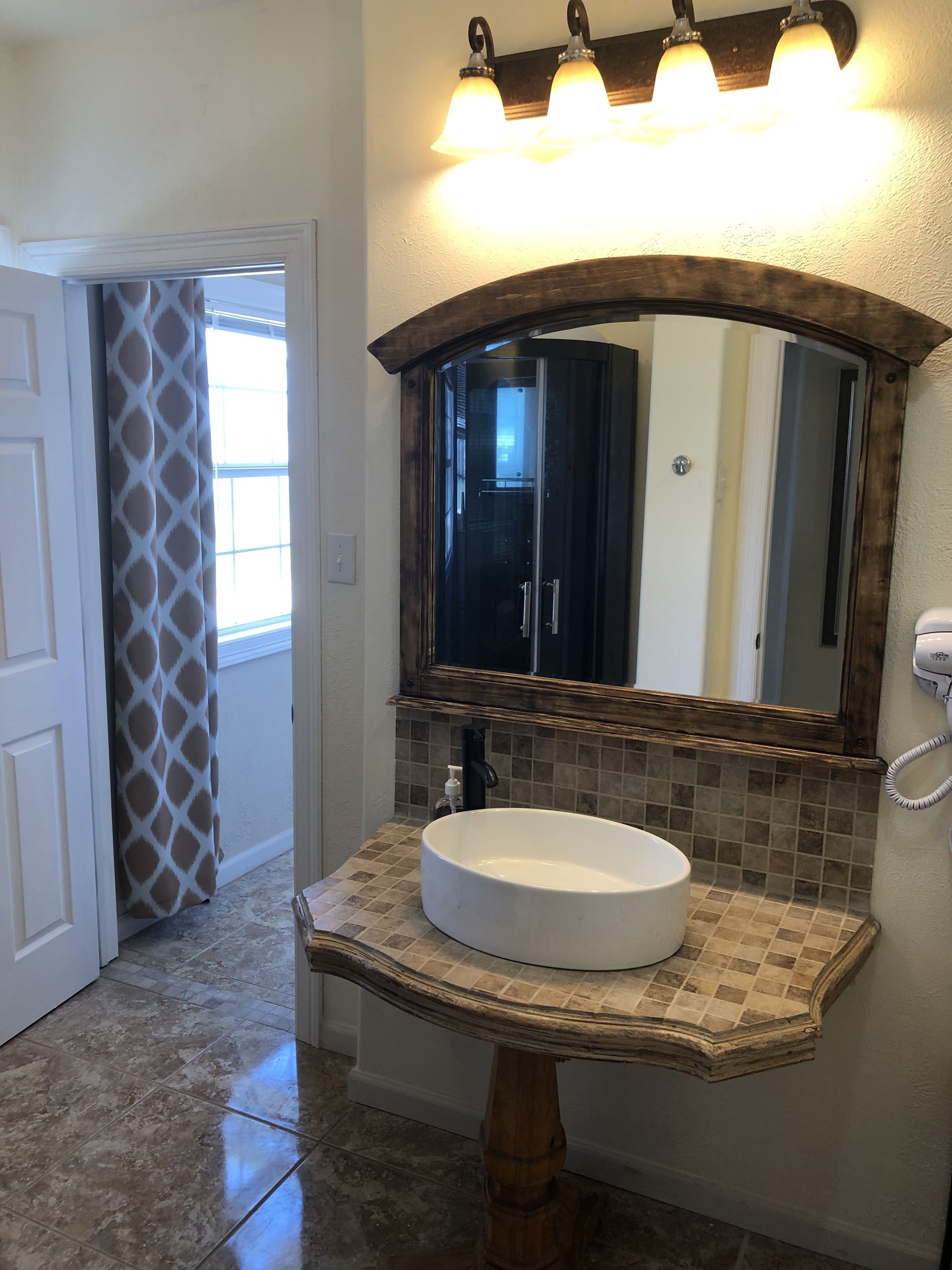 deluxe suite, 1 king bed, ocean view | bathroom | designer toiletries, hair dryer, towels