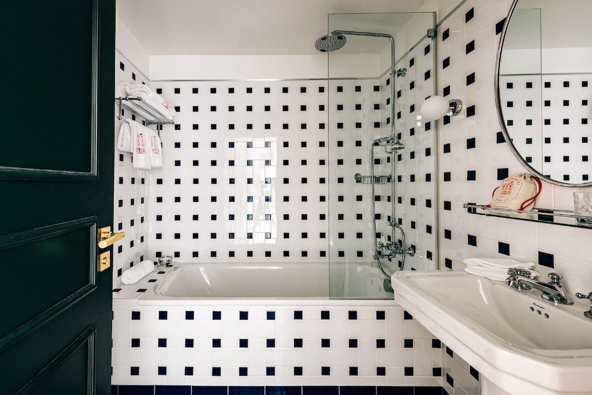 deluxe room, terrace | bathroom | jetted bath, designer toiletries, hair dryer, bathrobes