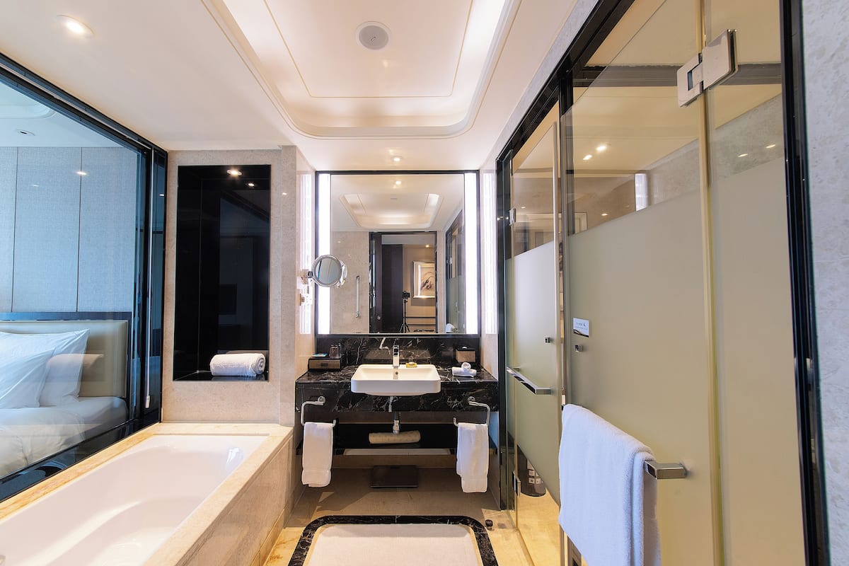 separate bathtub and shower, deep-soaking bathtub, rainfall showerhead