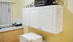Full-size fridge, microwave, stovetop, coffee/tea maker