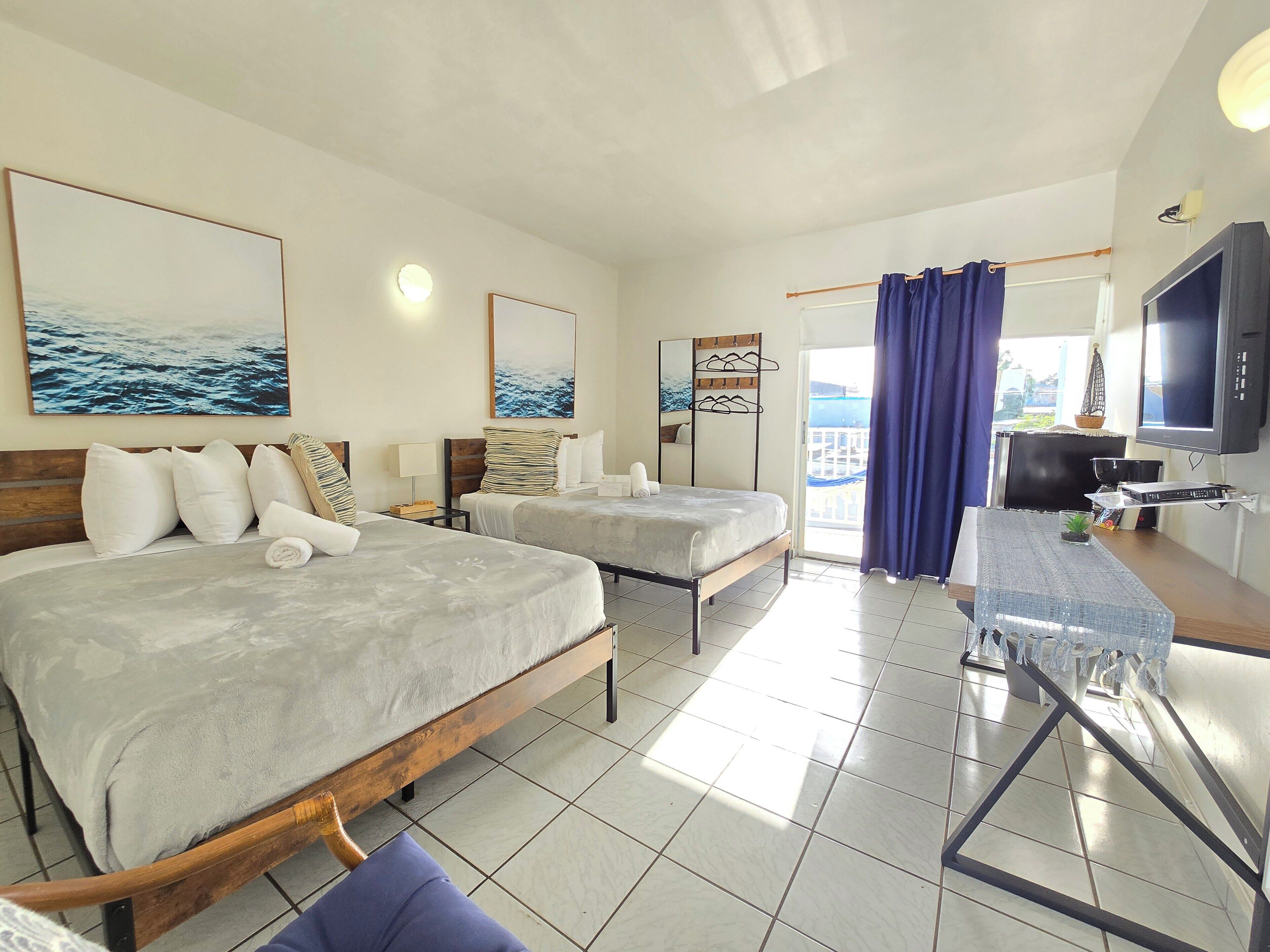 Standard room, 2 double beds with balcony | Iron/ironing board, free WiFi, bed sheets