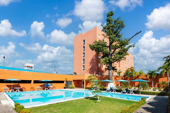 Outdoor pool, open 9:00 AM to 8:00 PM, pool umbrellas