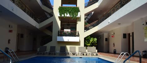 Outdoor pool, open 8:00 AM to 9:00 PM, sun loungers