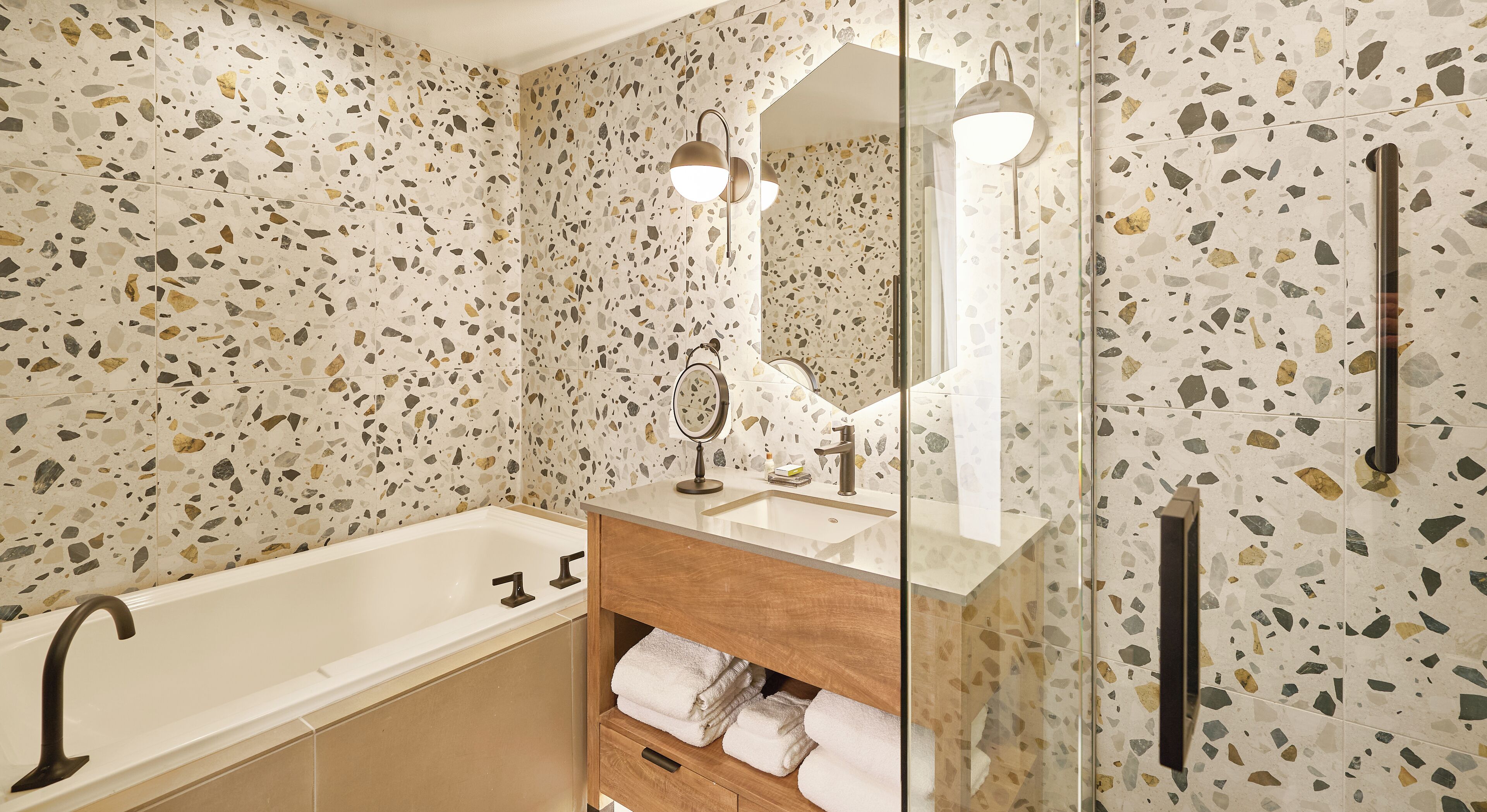 designer toiletries, hair dryer, slippers, towels