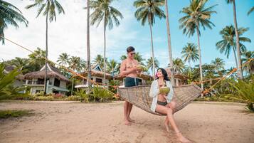 On the beach, sun loungers, beach volleyball, beach bar