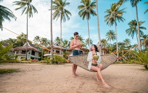 On the beach, sun loungers, beach volleyball, beach bar