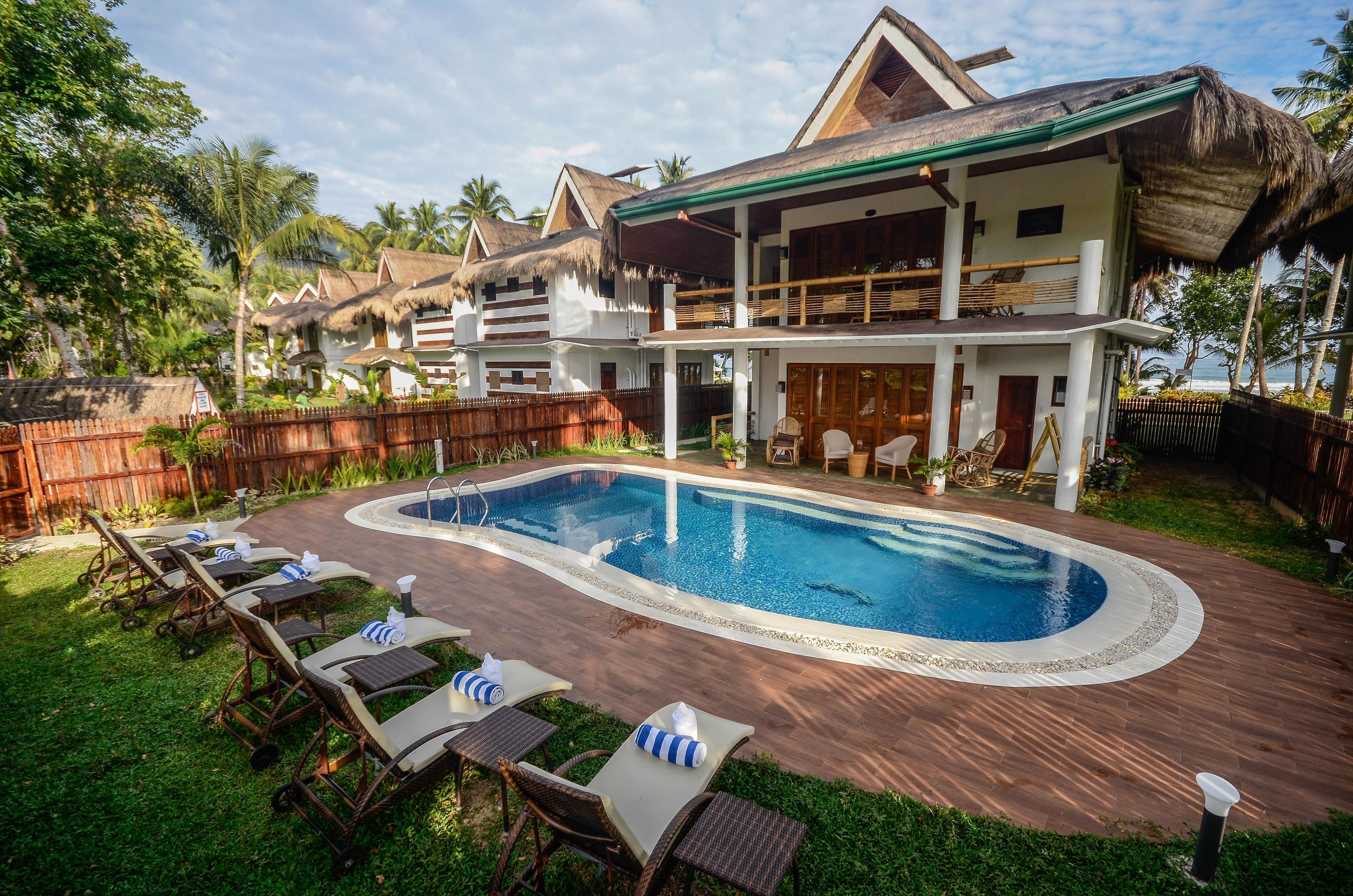Suite, Beachfront (Daluyon) | Outdoor pool | 2 outdoor pools, pool umbrellas, sun loungers