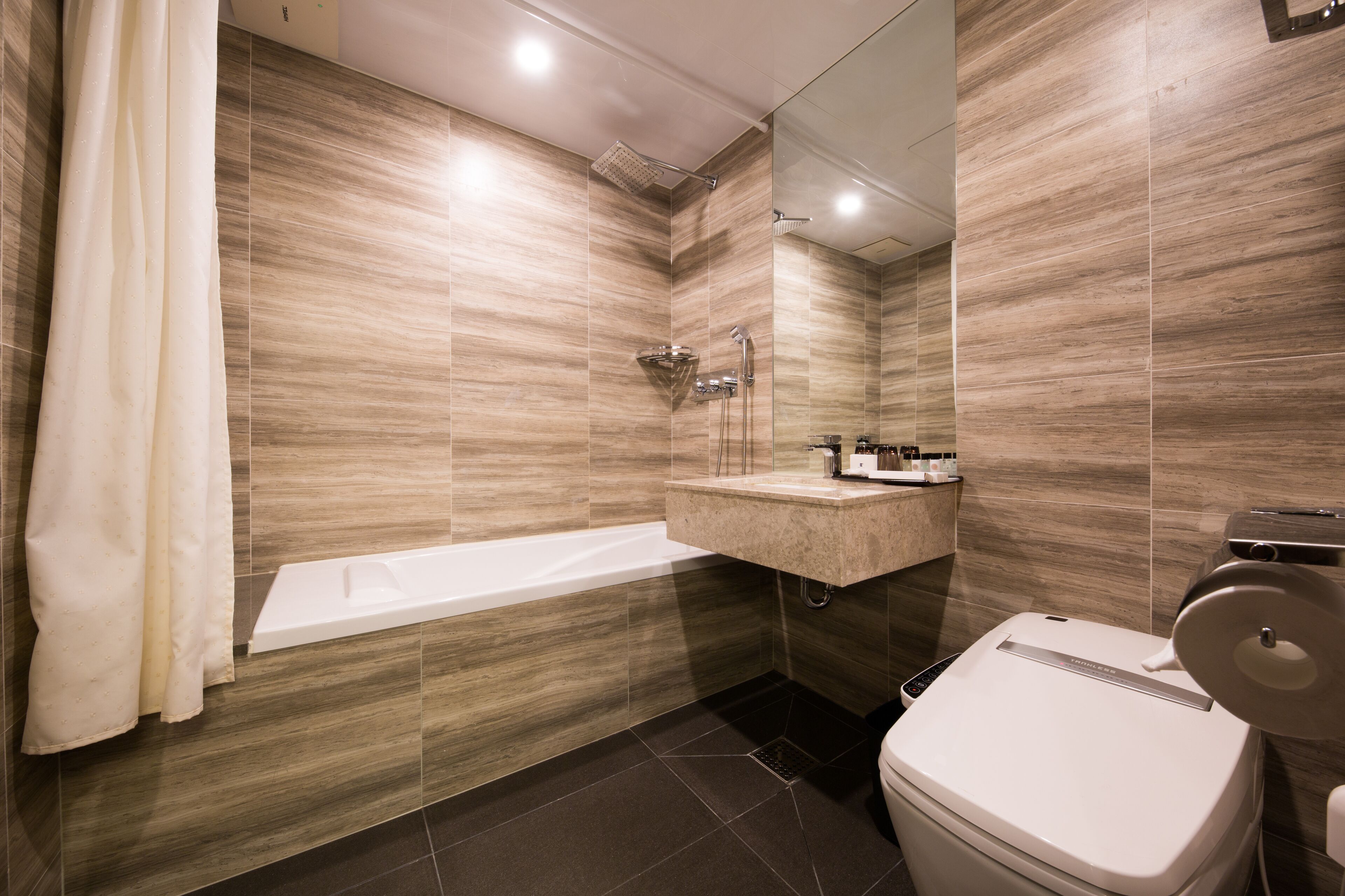 hair dryer, bathrobes, slippers, bidet