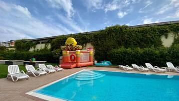 Seasonal outdoor pool, pool loungers