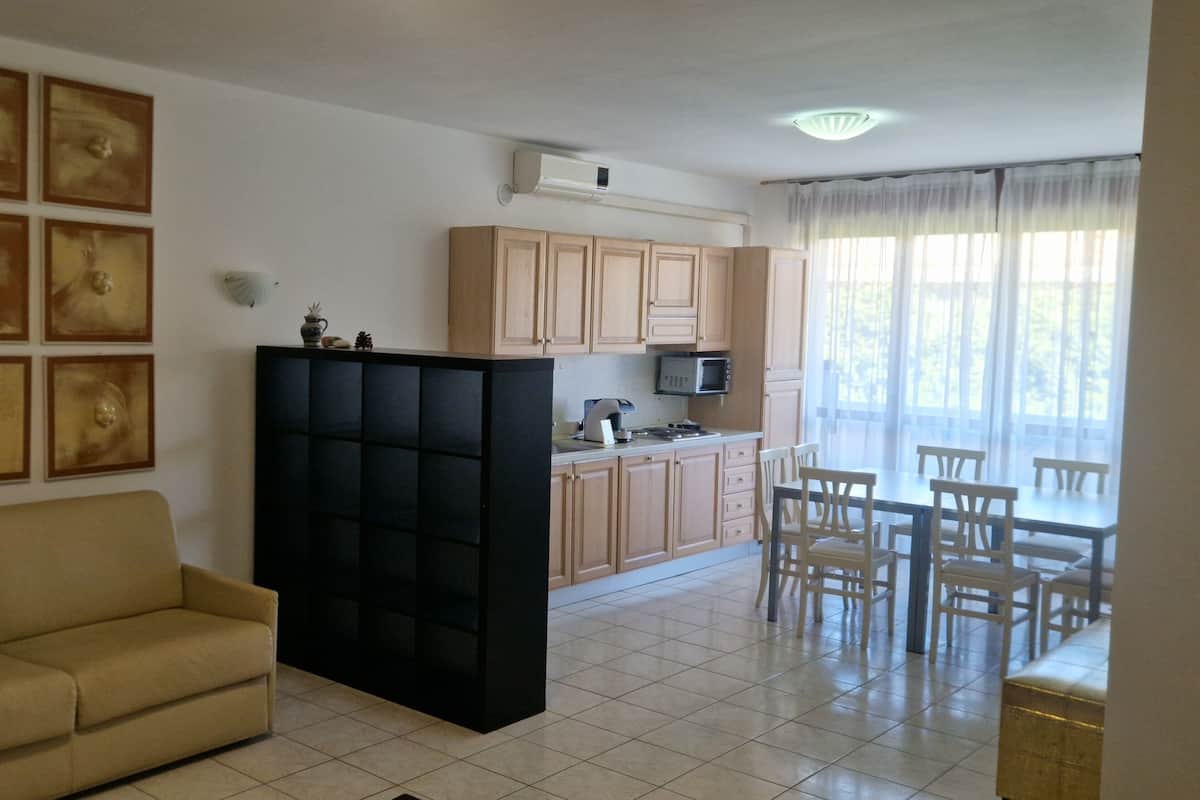 Executive Apartment, 2 Bedrooms, Courtyard Area | Living area | 32-inch flat-screen TV with satellite channels, TV