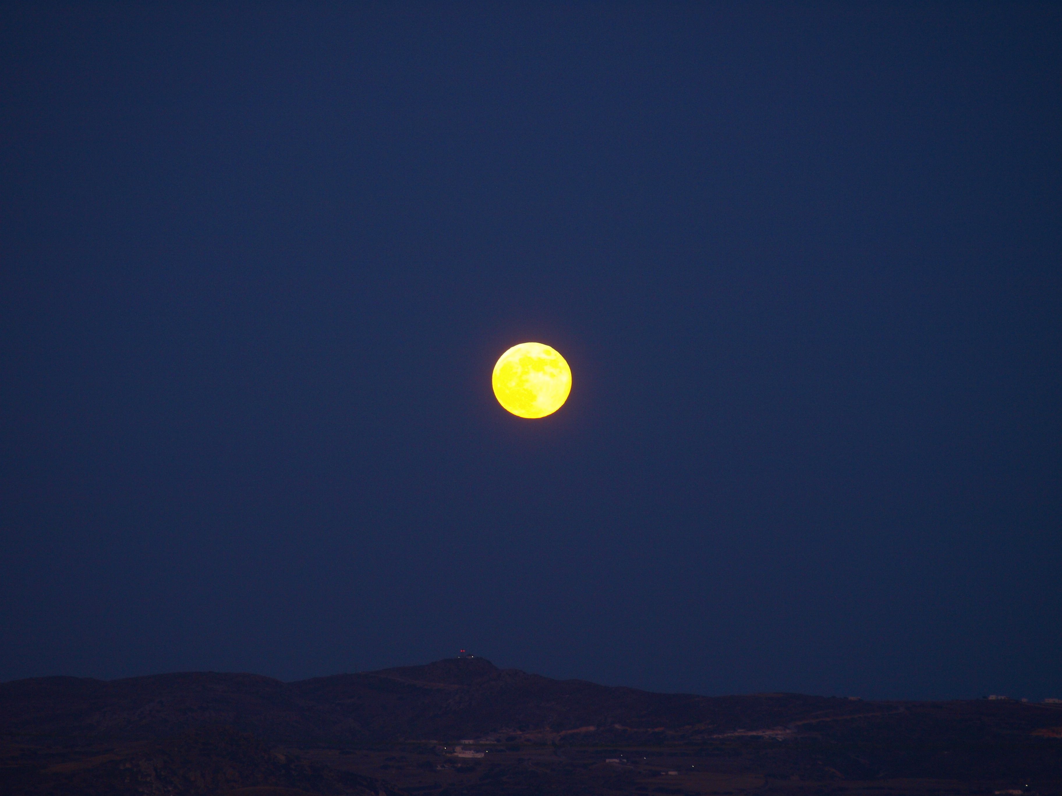 A full moon in a clear night sky.