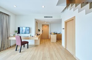 Duplex Suite | Living area | 32-inch LCD TV with cable channels, TV - Adelphi Pattaya (Pattaya)