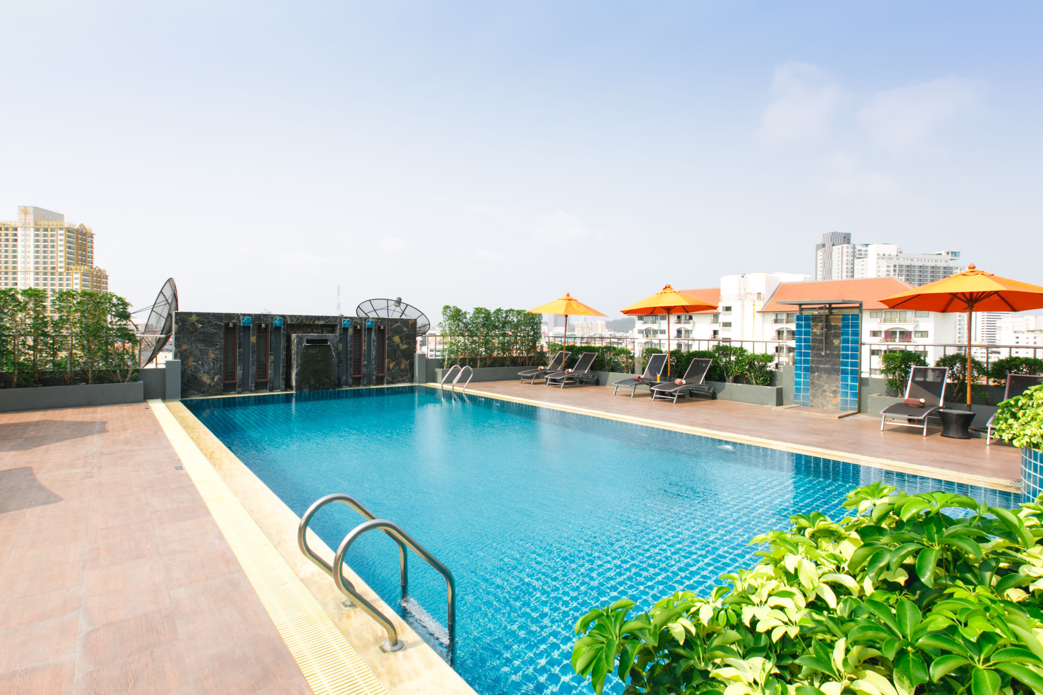 outdoor pool, pool umbrellas, pool loungers