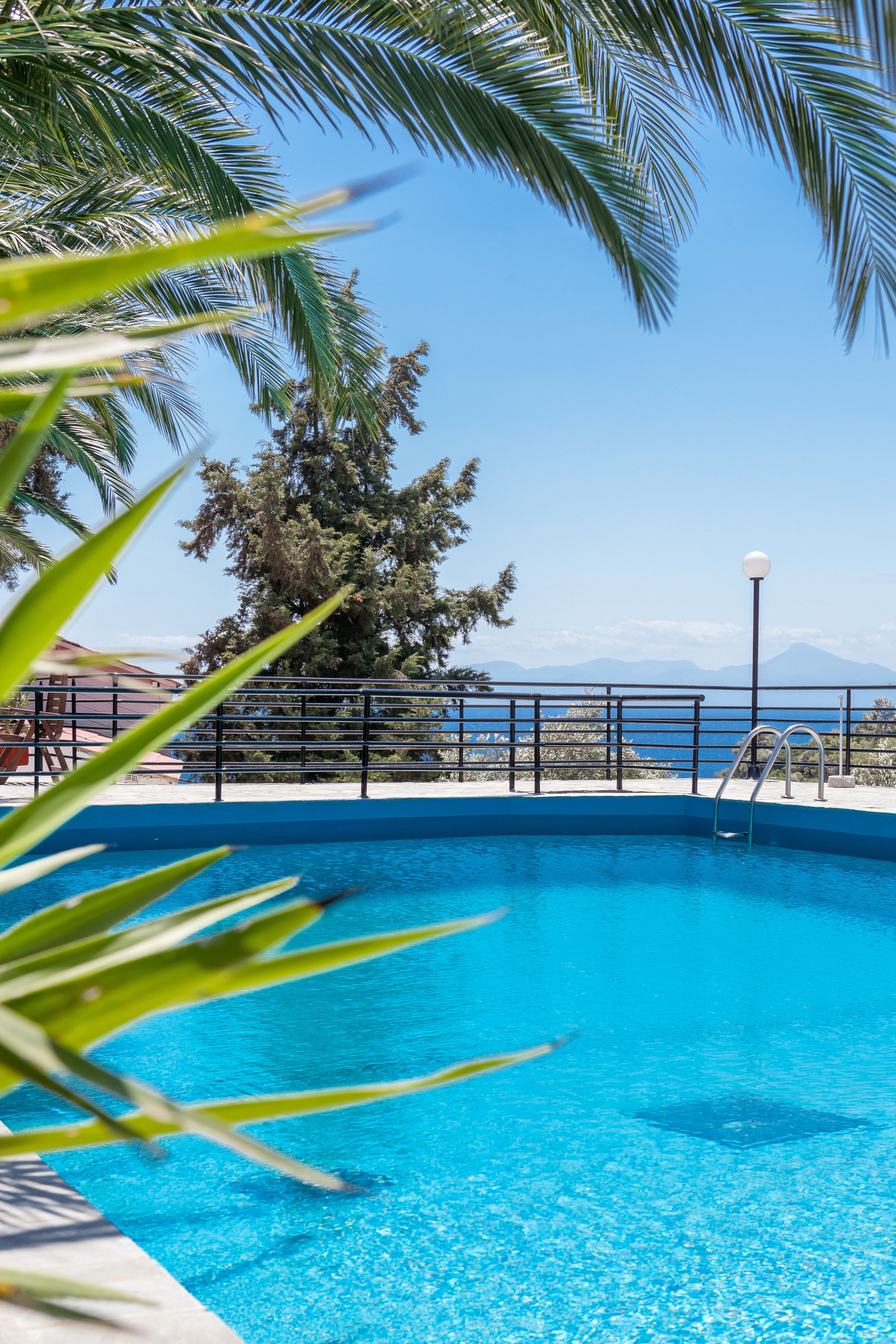 Seasonal outdoor pool, open noon to 8:00 PM, pool umbrellas