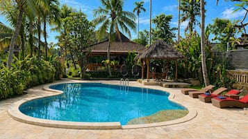 Outdoor pool, open 7:00 AM to 10:00 PM, pool loungers