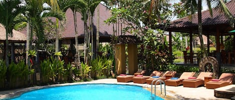 Outdoor pool, open 7:00 AM to 10:00 PM, pool loungers