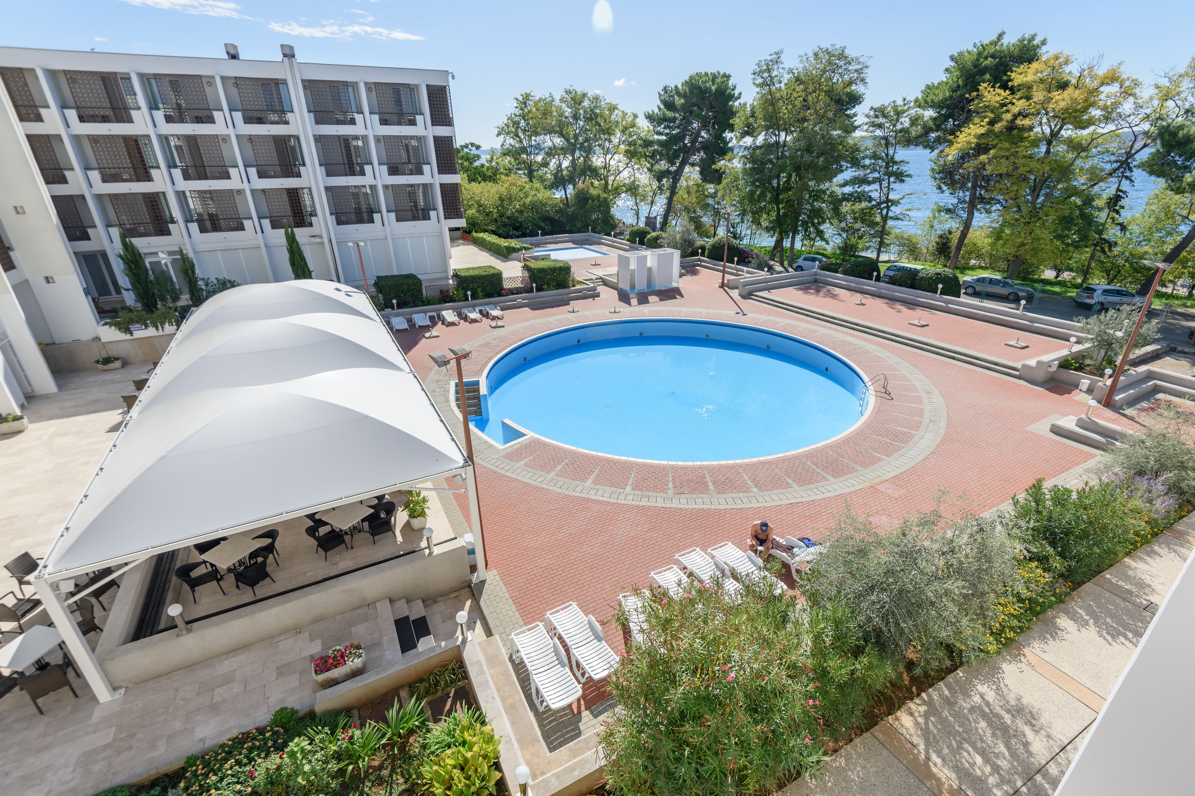 Seasonal outdoor pool, open 9 AM to 8 PM, pool umbrellas, sun loungers