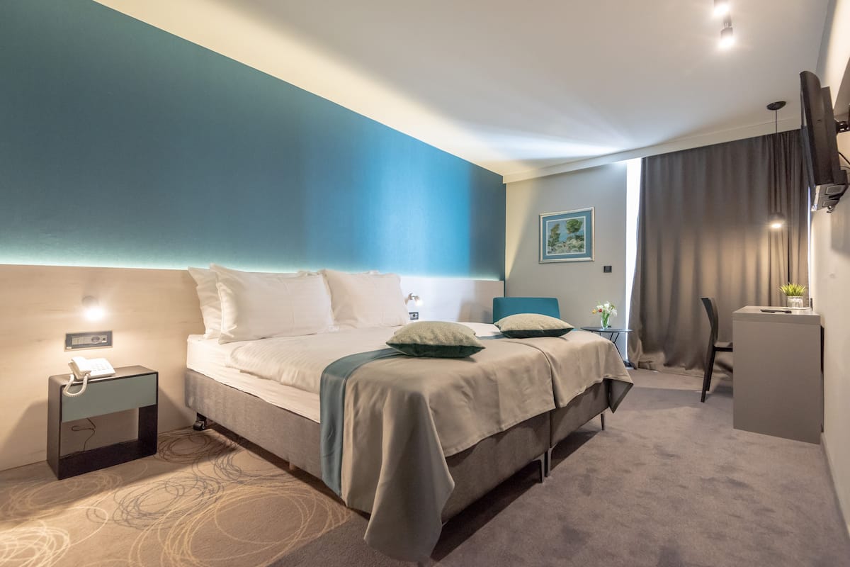 superior double or twin room | minibar, in-room safe, desk, blackout curtains