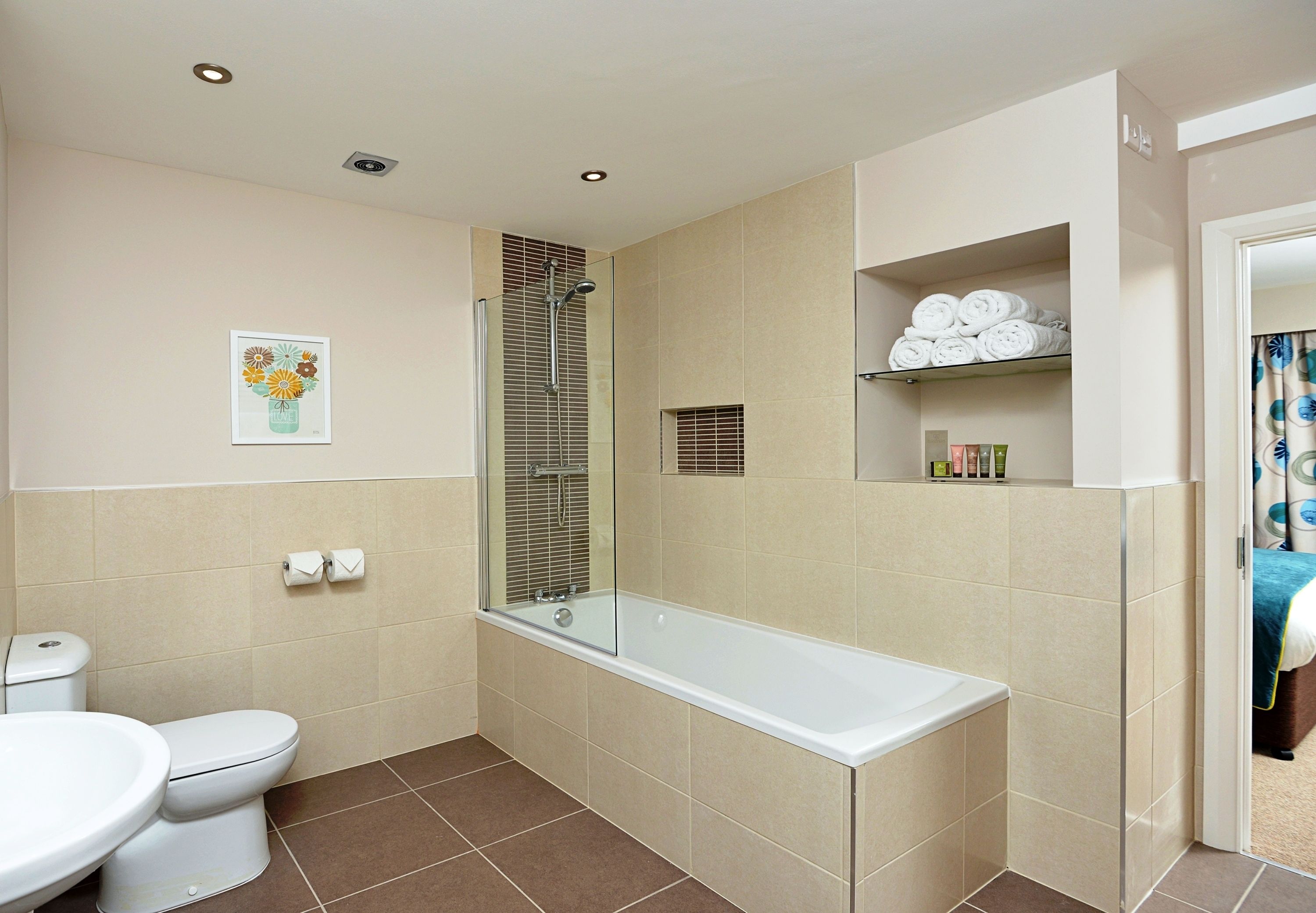 designer toiletries, hair dryer, towels