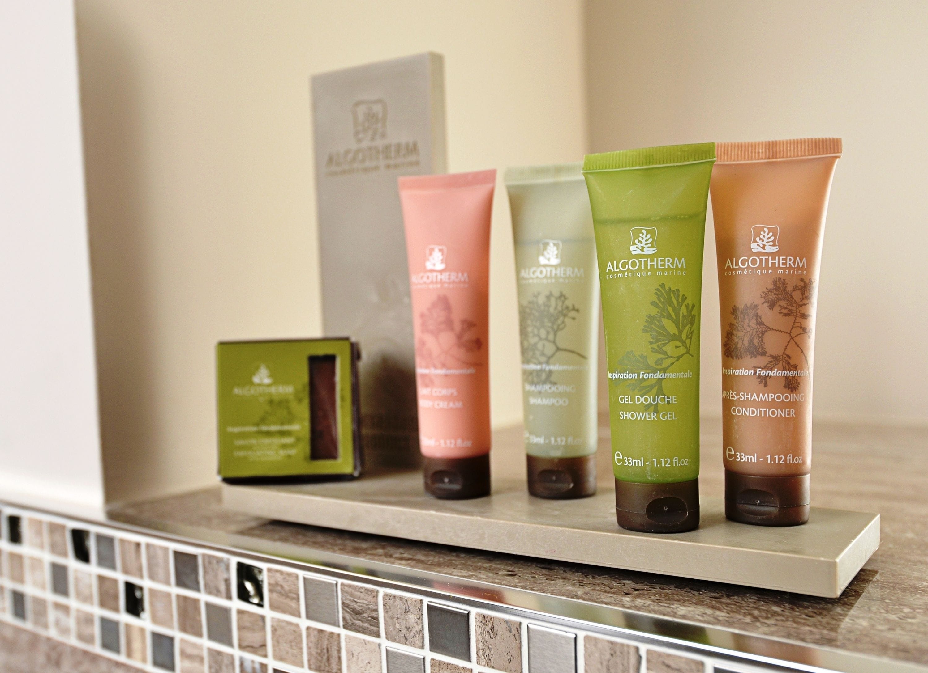 designer toiletries, hair dryer, towels