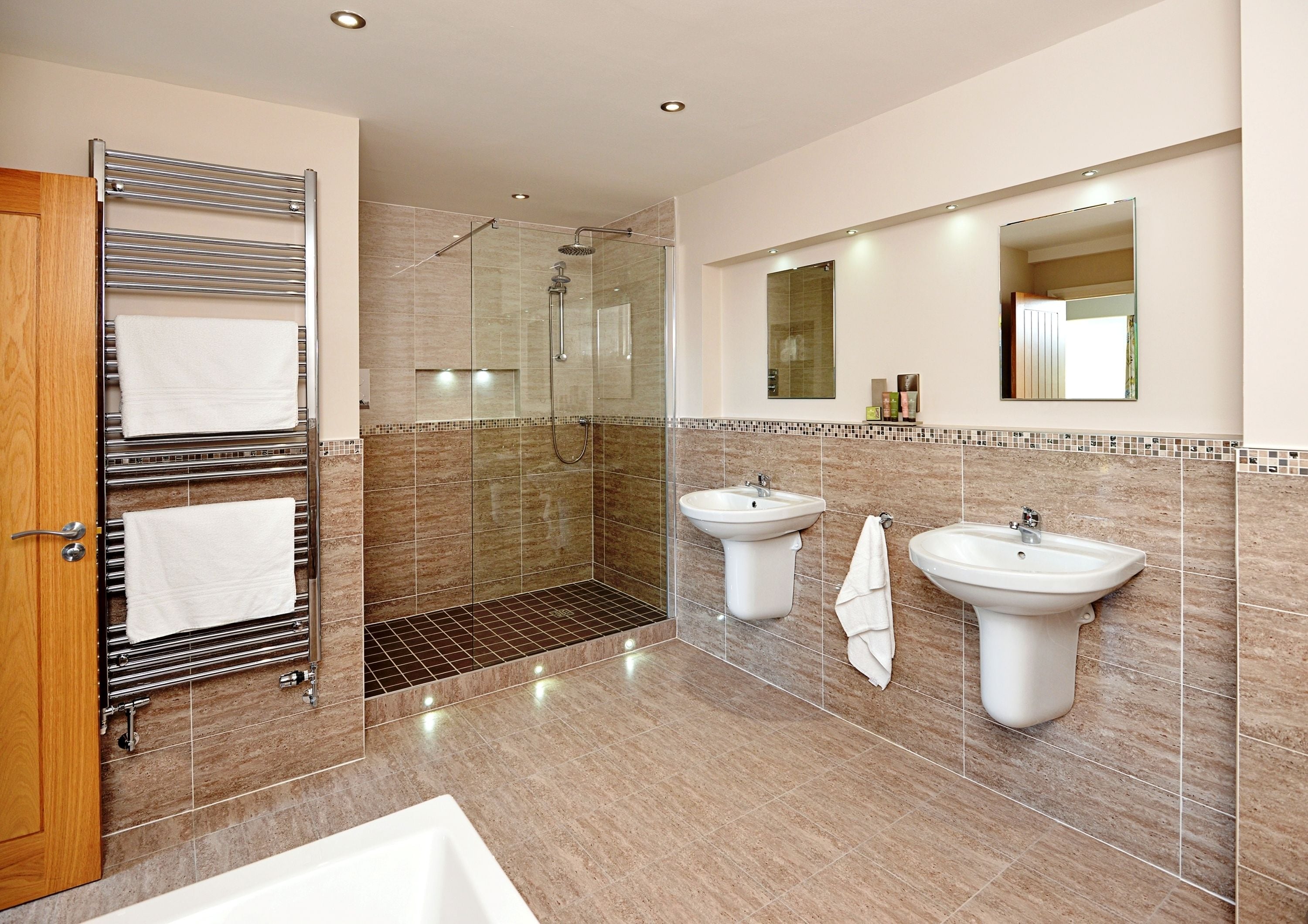 designer toiletries, hair dryer, towels