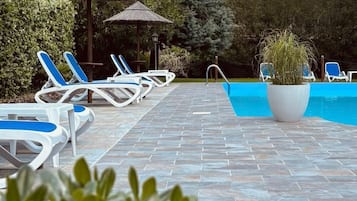 Seasonal outdoor pool, pool umbrellas, pool loungers