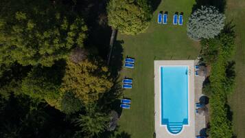 Seasonal outdoor pool, pool umbrellas, pool loungers