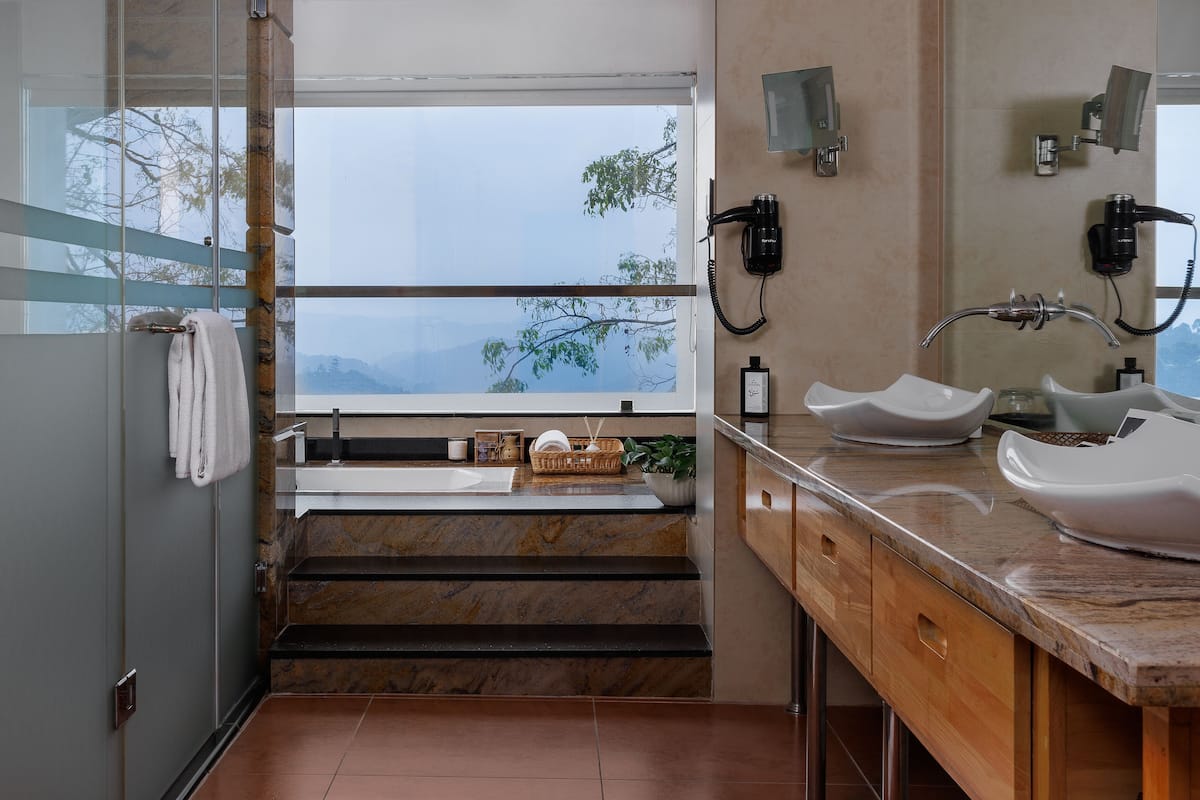 panoramic suite | bathroom | rainfall showerhead, free toiletries, hair dryer, slippers