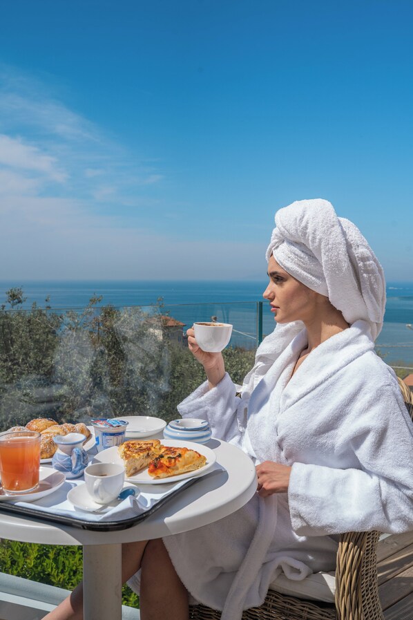 Suite, 1 King Bed, Sea View | Terrace/patio