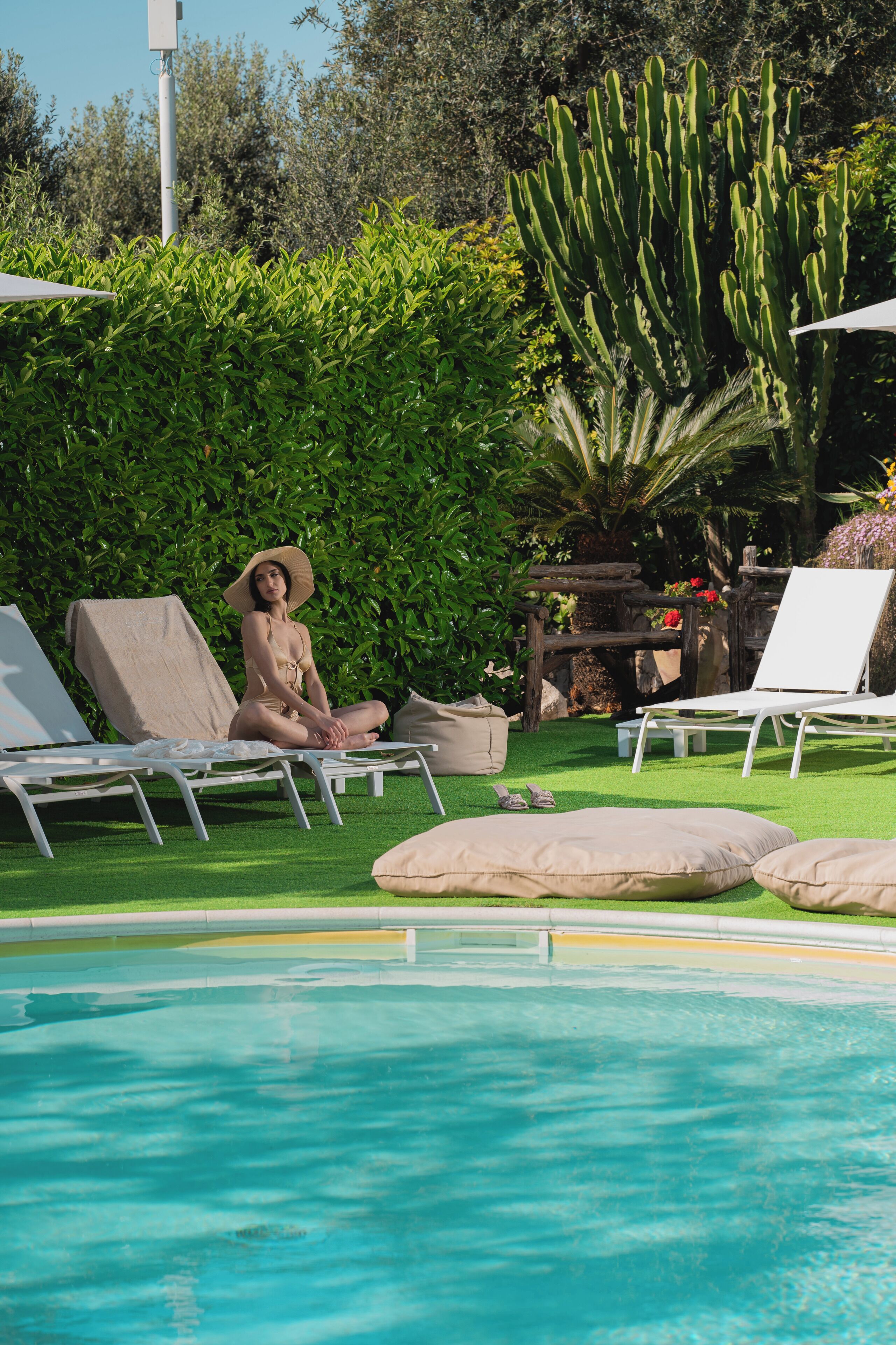 Outdoor pool, open 10:00 AM to 6:00 PM, pool umbrellas, pool loungers