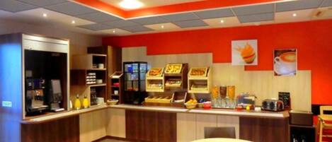 A restaurant with a counter, seating area, and various food display cases.
