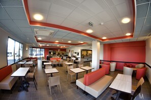 Enjoy a casual dining experience with a mix of booths and tables in this welcoming space.