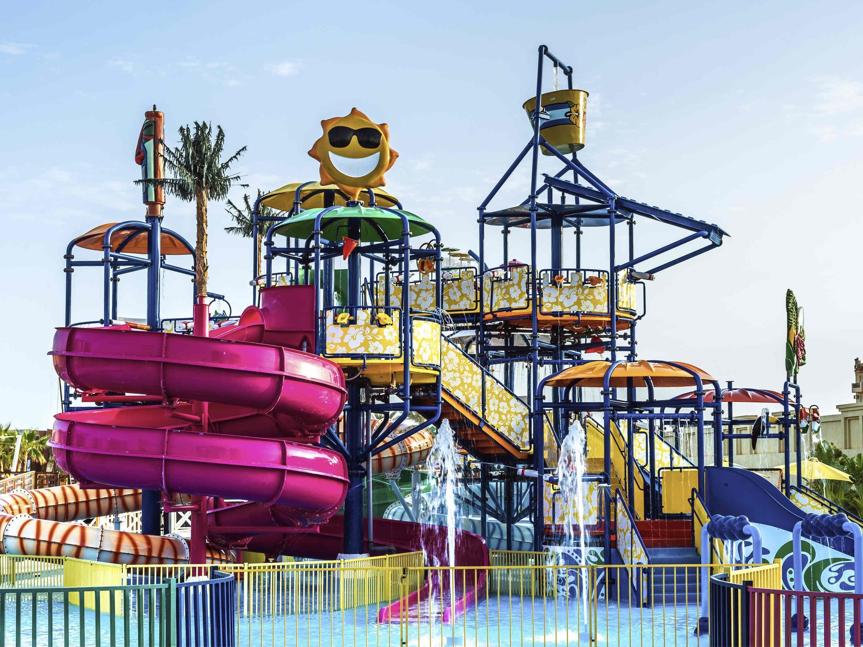A water park with multiple slides and water features.