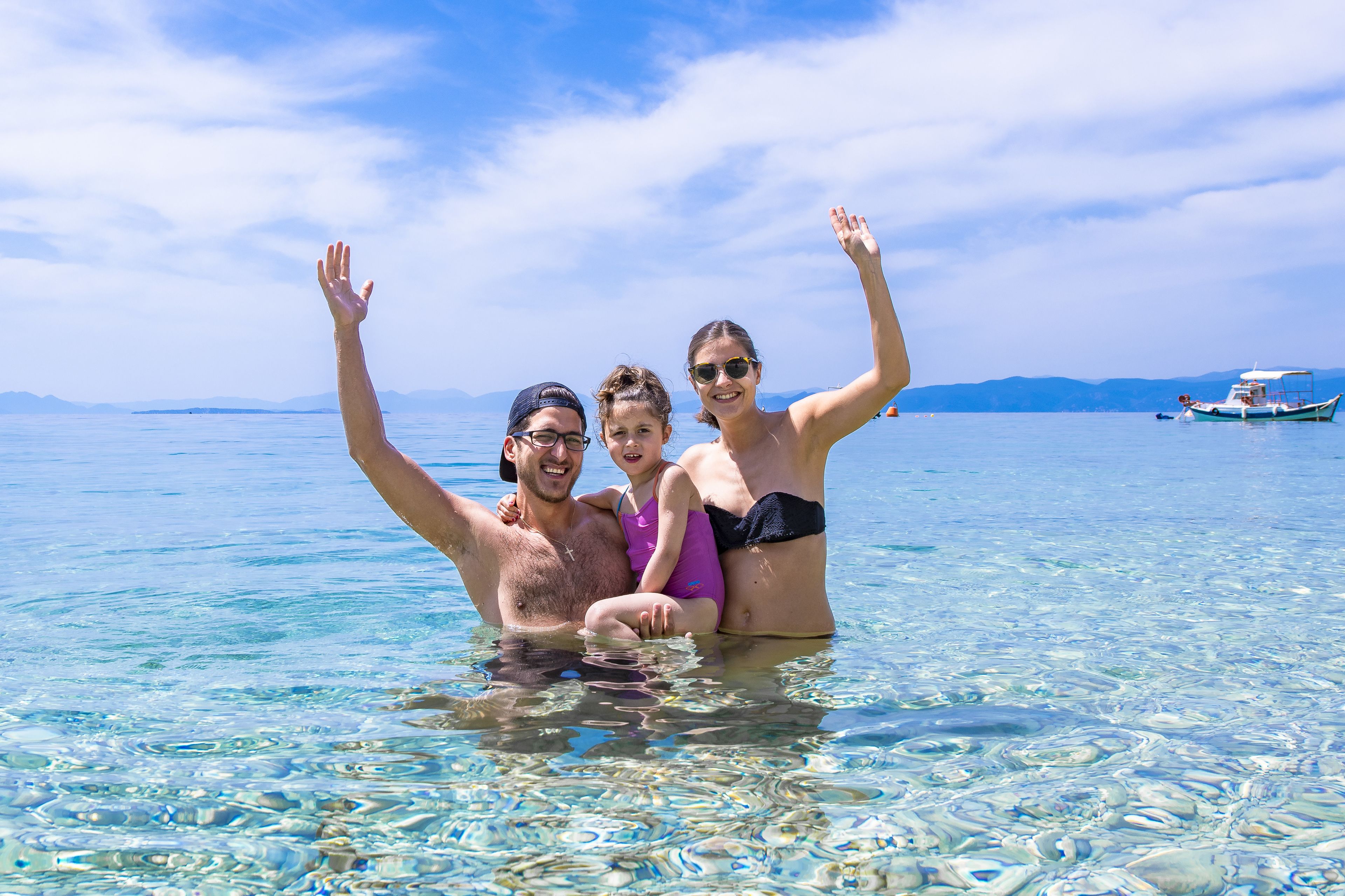 On the beach, white sand, sun-loungers, beach umbrellas