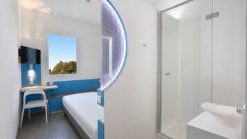 Premium bedding, desk, laptop workspace, blackout curtains