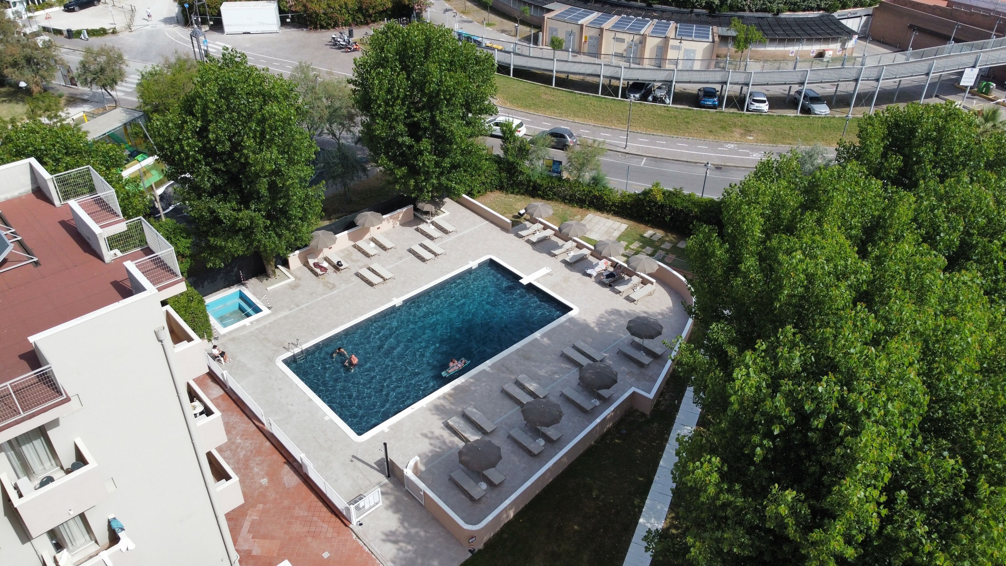seasonal outdoor pool, open 10:00 am to 7:00 pm, pool umbrellas