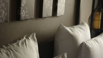A room with a sofa and three wall-mounted picture frames.
