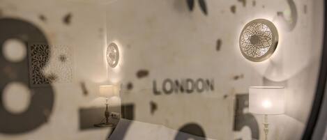 A clock with the word "LONDON" on it, indicating the hotel's location.