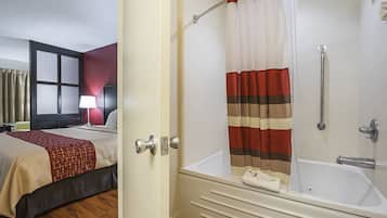 Suite, 1 King Bed with Sofa bed, Non Smoking, Jetted Tub | Bathroom | Free toiletries, hair dryer, towels, soap