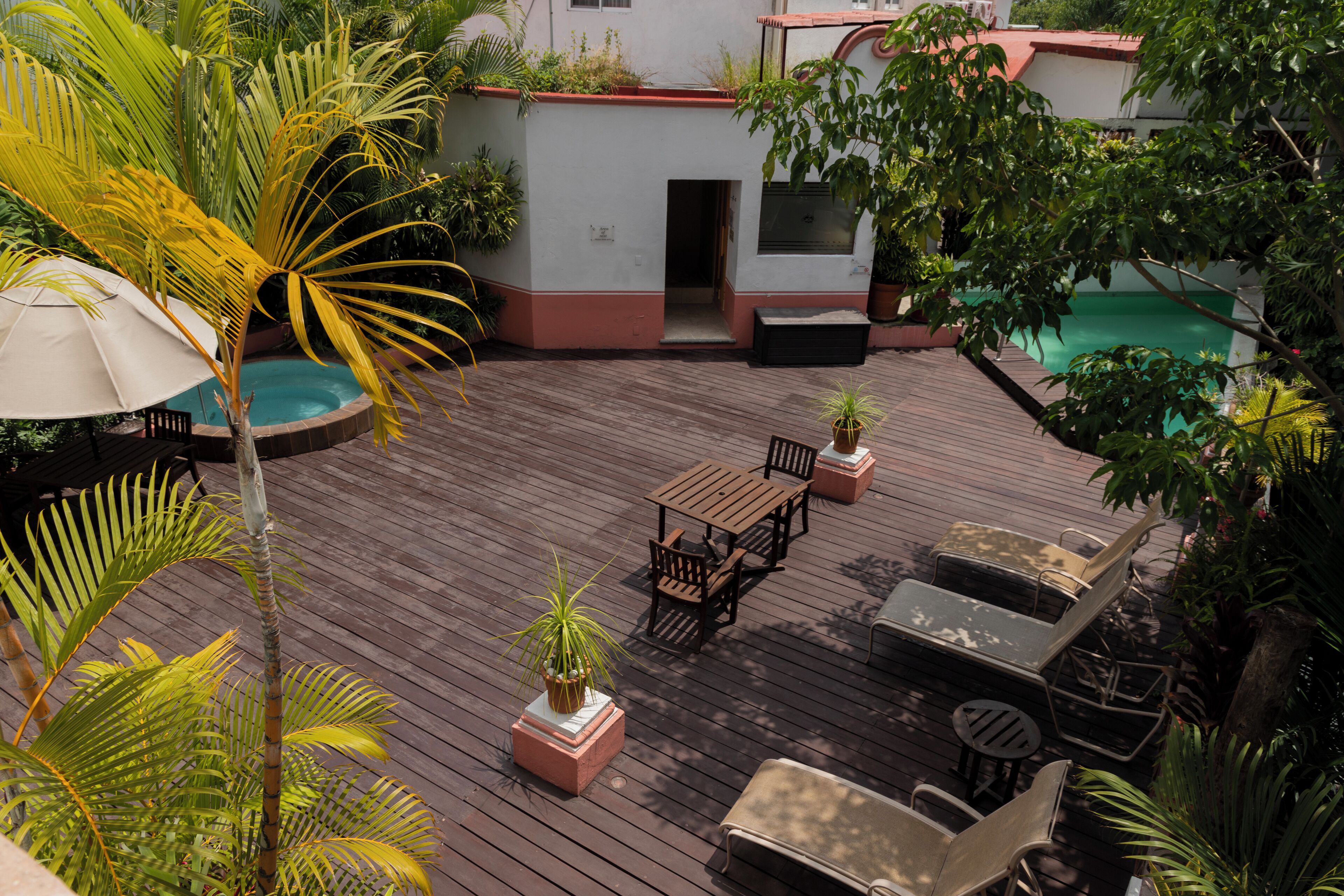 outdoor pool, pool umbrellas, pool loungers