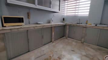 Full-size fridge, coffee/tea maker, cookware/dishes/utensils