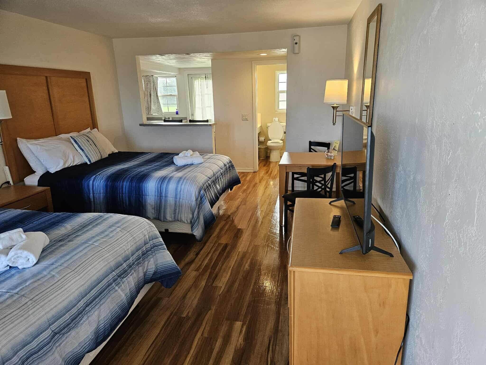 Premium Kitchen with 2 Queen beds and Balcony | Premium bedding, individually decorated, individually furnished