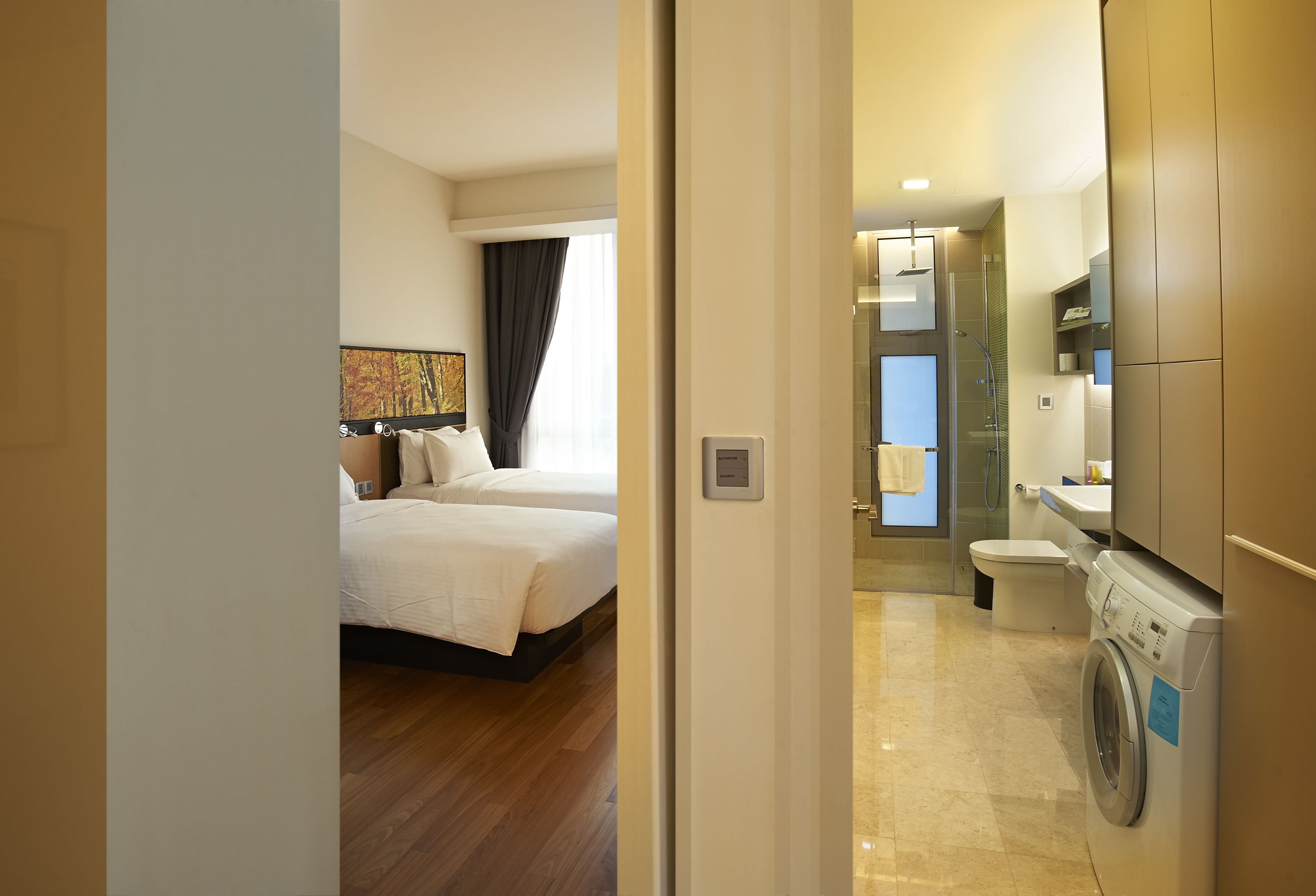 signature suite | bathroom | shower, free toiletries, hair dryer, slippers