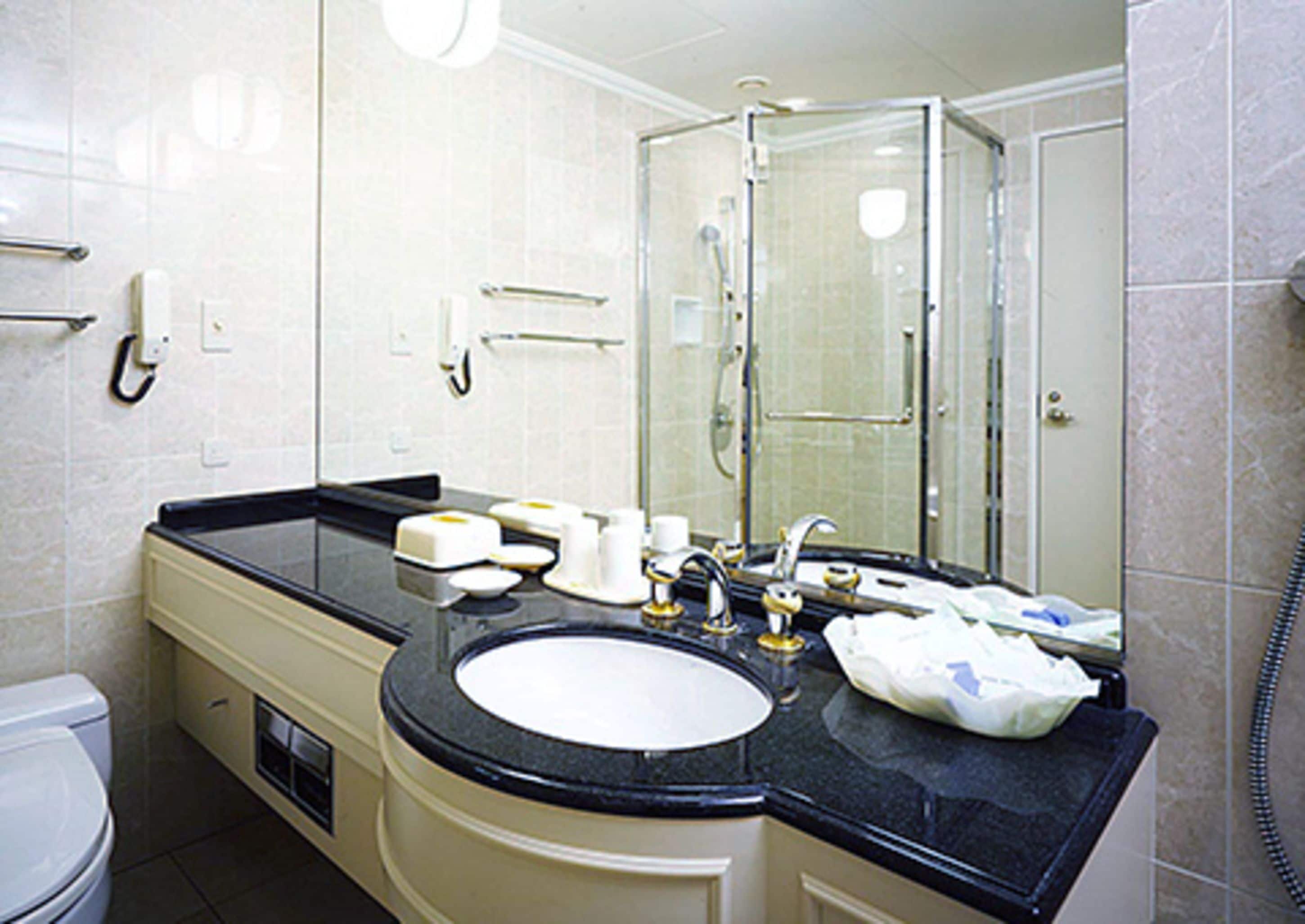 hair dryer, slippers, electronic bidet, towels