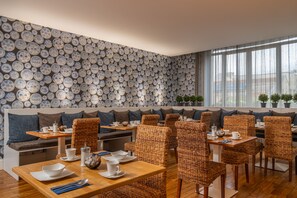 Enjoy a casual dining experience with comfortable seating and elegant table settings.