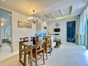Exclusive Apartment | Living area | 40-inch LED TV with cable channels, TV, DVD player - Chelona Huahin Condo Garden View by Dome (Hua Hin)