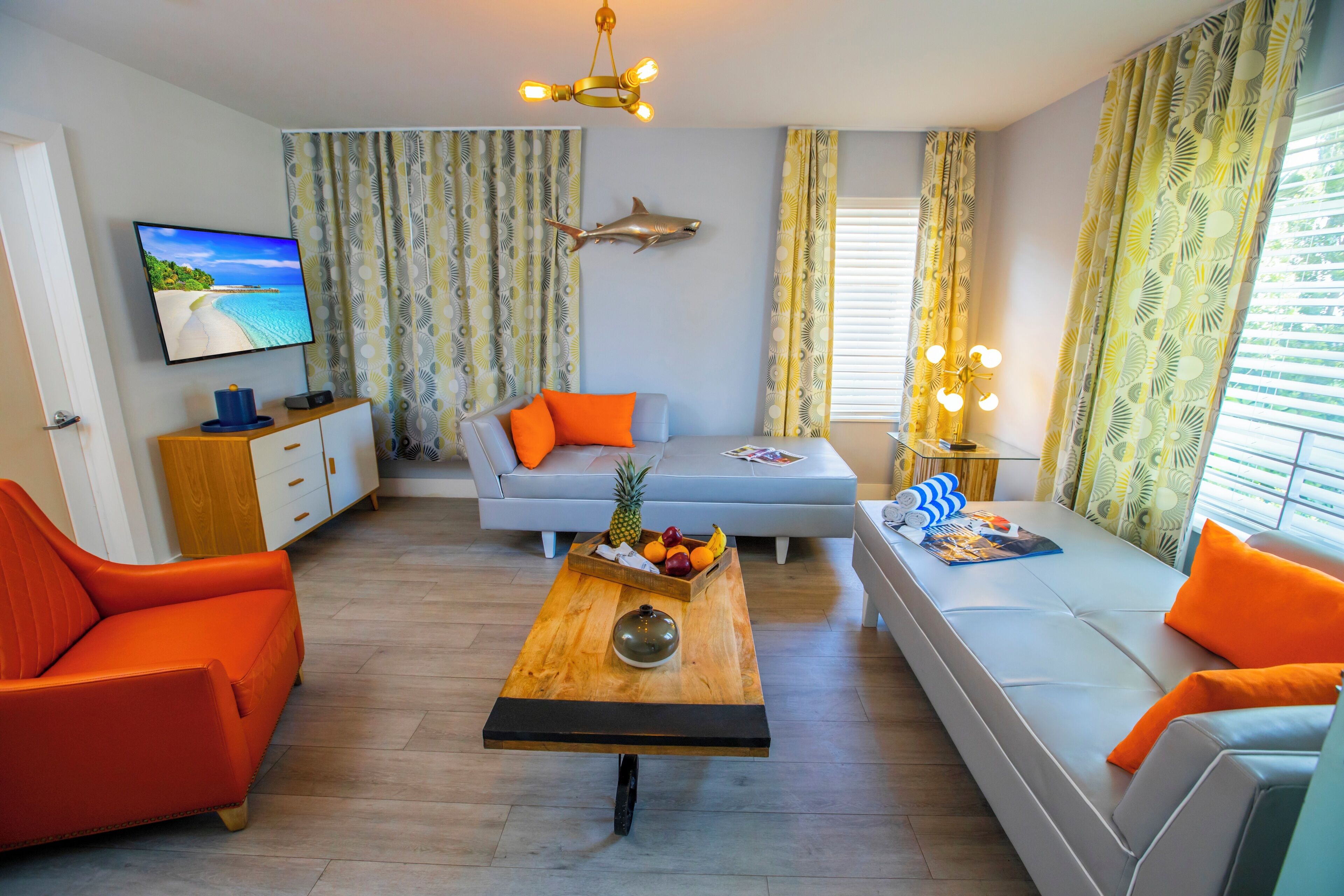 One Bedroom Queen Suite | Living area | 42-inch plasma TV with cable channels, TV