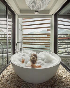 Designer toiletries, hair dryer, bathrobes, slippers